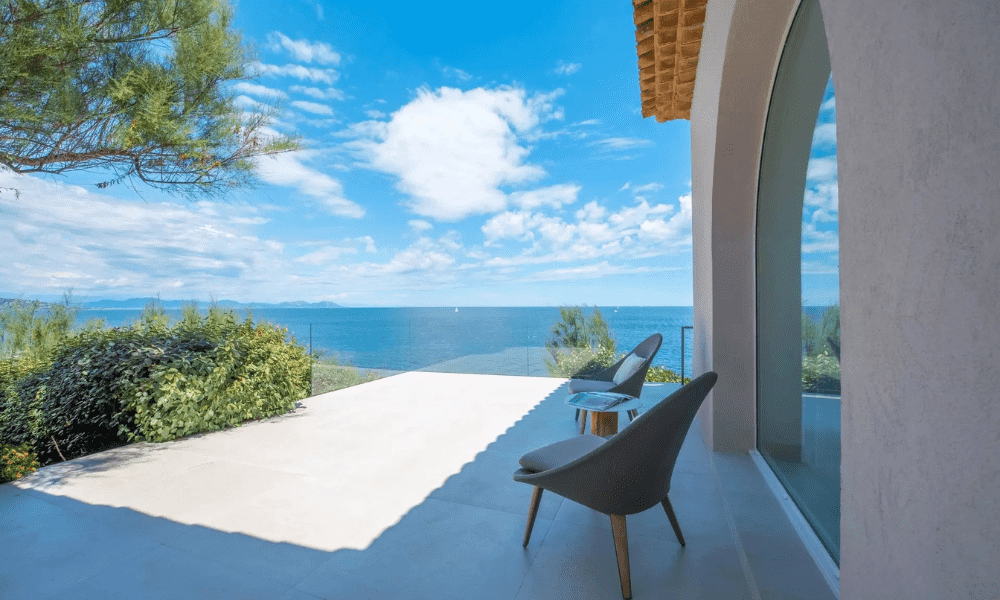 Wide-angle exterior view capturing villa and landscape